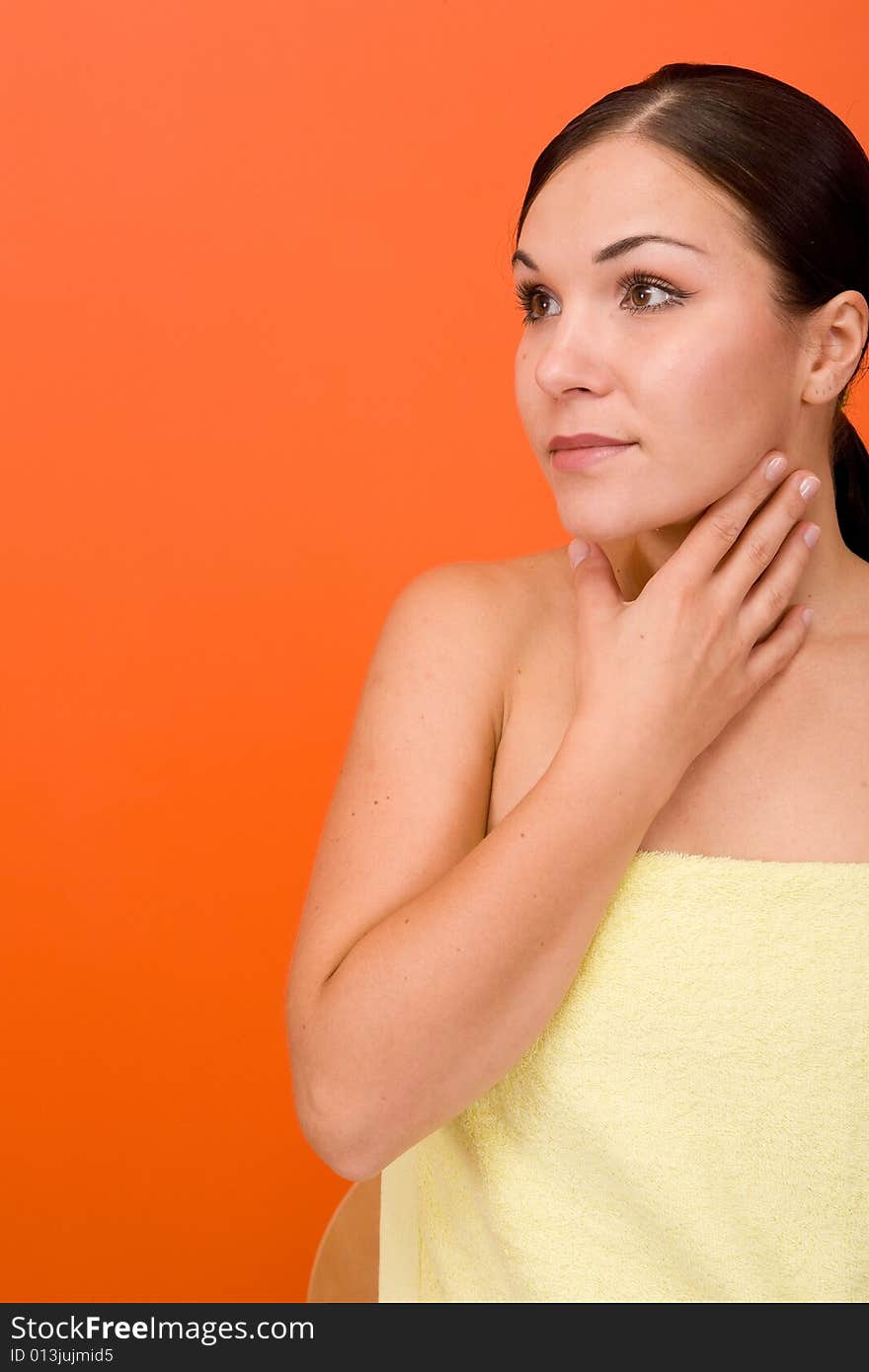 Attractive and fresh brunette woman on orange background. Attractive and fresh brunette woman on orange background