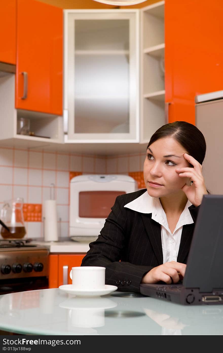 Attractve brunette woman in kitchen. Attractve brunette woman in kitchen