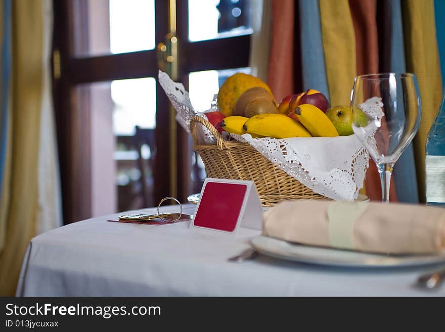 Champagne glasses and bottle in hotel suite for celebration