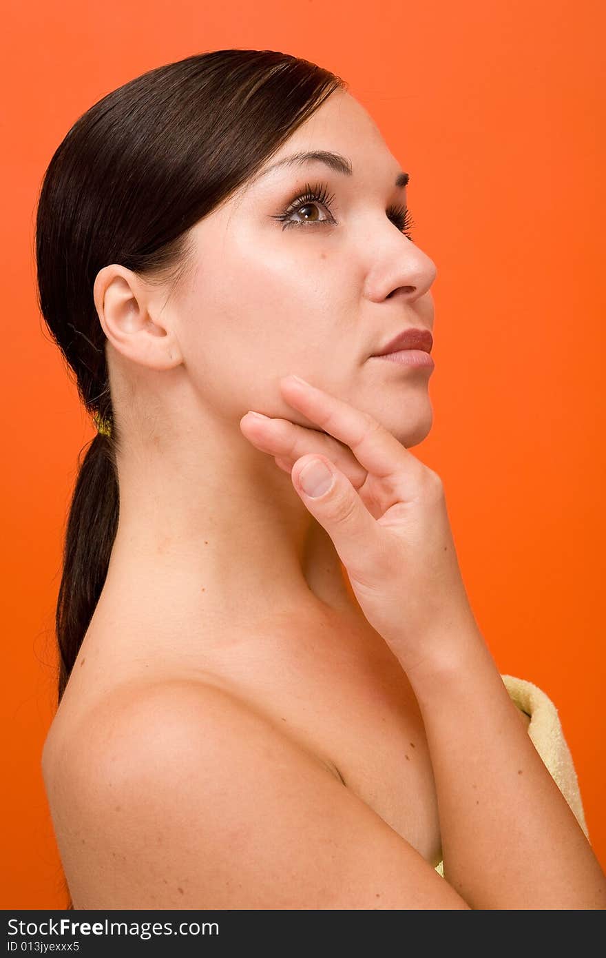 Attractive and fresh brunette woman on orange background. Attractive and fresh brunette woman on orange background