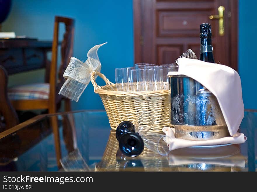 Champagne glasses and bottle in hotel suite for celebration