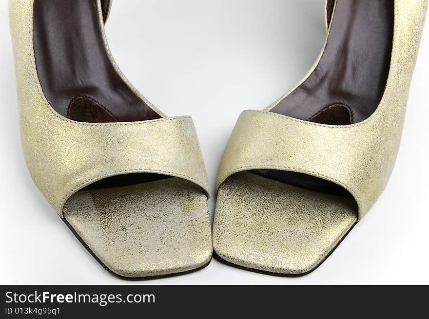 Golden designer lady's shoes - closeup