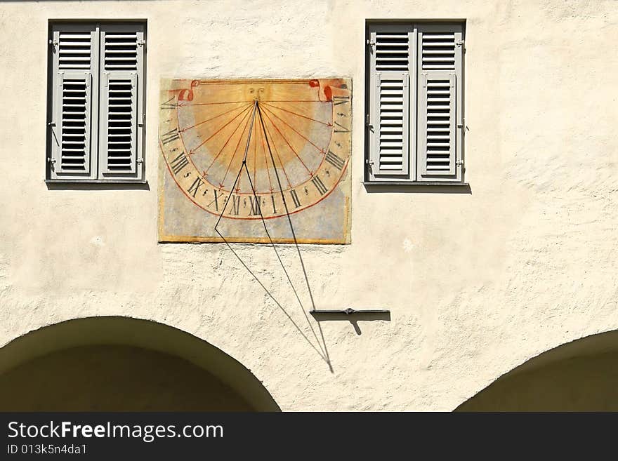 Old colorful solar clock on a house. Old colorful solar clock on a house