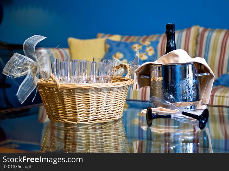 Champagne glasses and bottle in hotel suite for celebration