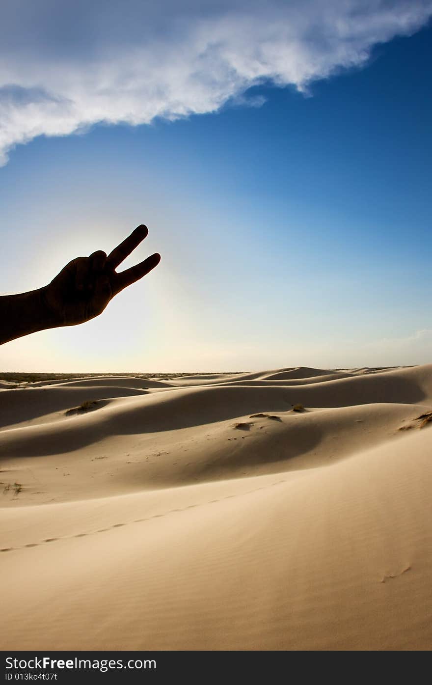 An image of a man's silhouetted hand holding a peace sign. An image of a man's silhouetted hand holding a peace sign