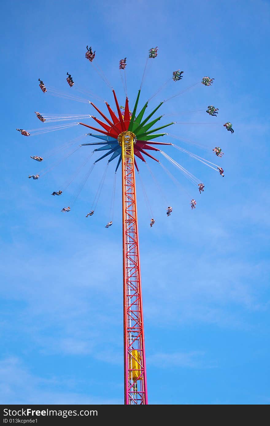 High carrousel on a blue sky