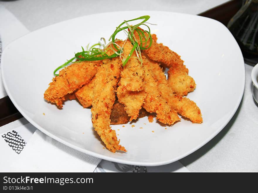 Deep fried fish fillet served in a dish