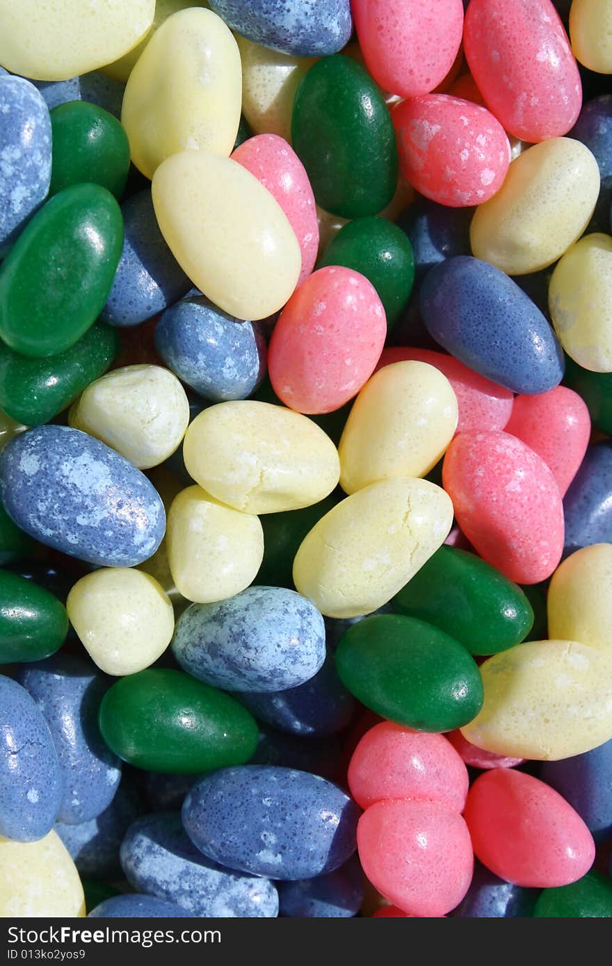 Jelly beans scattered around background.