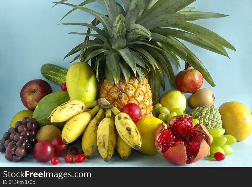 Still life with fruits on blue background.