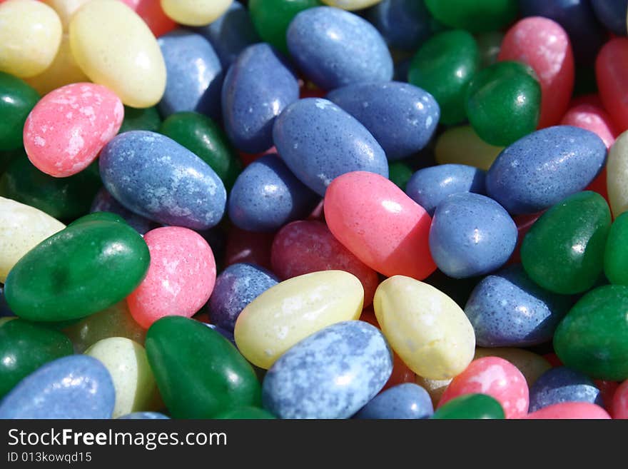 Jelly beans scattered around background.