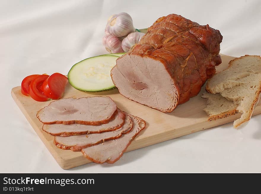 Ham with bread and vegetables