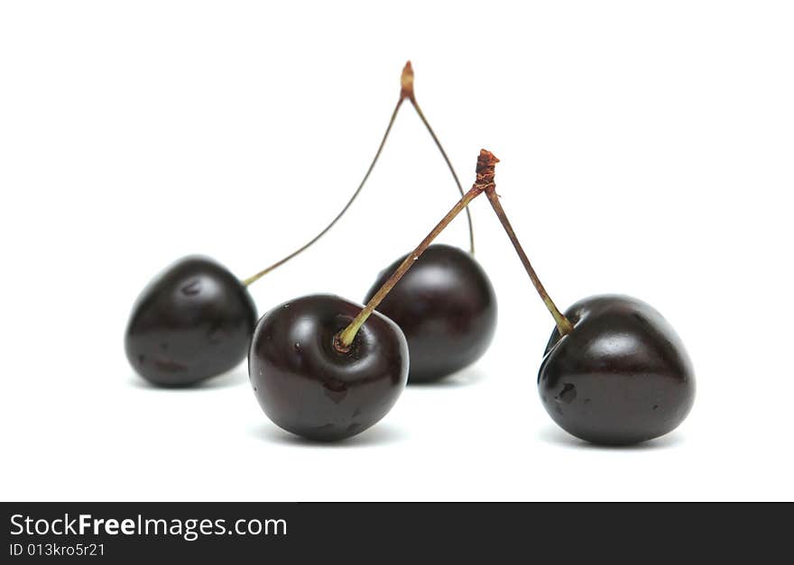 Two berries of a sweet cherry on a white background