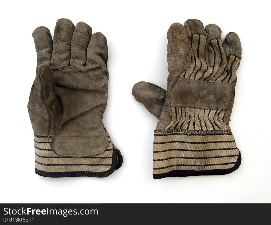 Used dirty protective gloves on white background