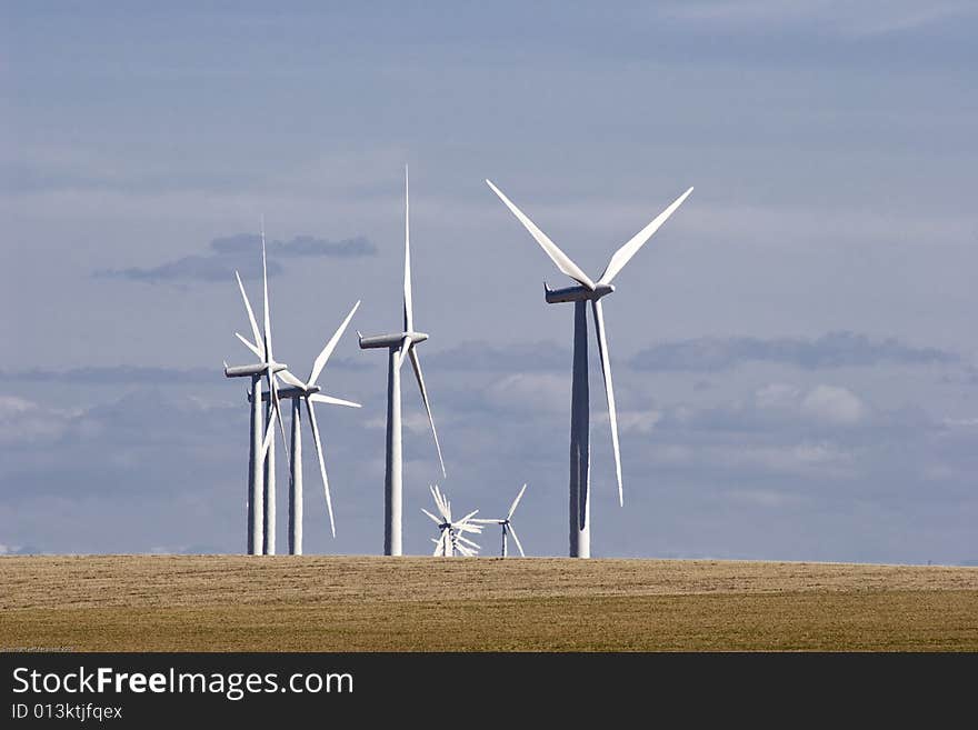 Group of Wind Mills on windfarm on a cloudy day. Group of Wind Mills on windfarm on a cloudy day