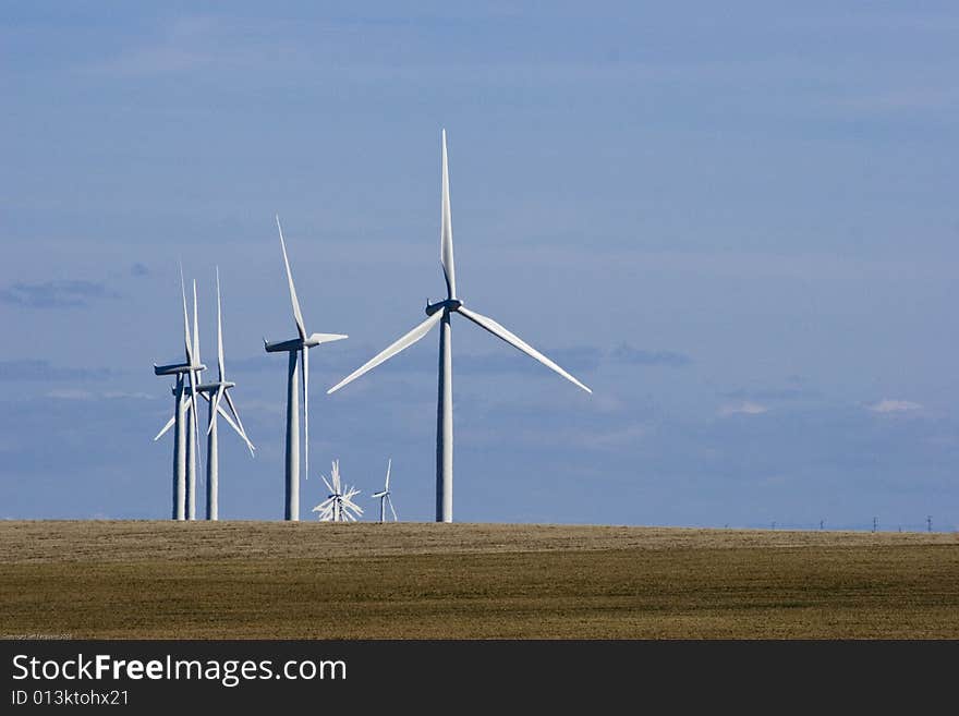 Group of Wind Mills on windfarm on a cloudy day. Group of Wind Mills on windfarm on a cloudy day