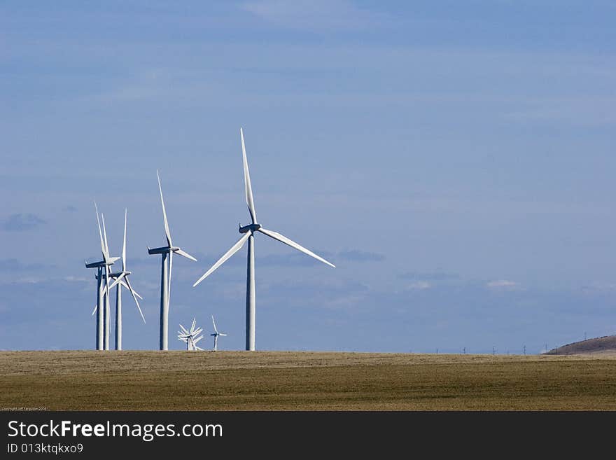 Group of Wind Mills on windfarm on a cloudy day. Group of Wind Mills on windfarm on a cloudy day