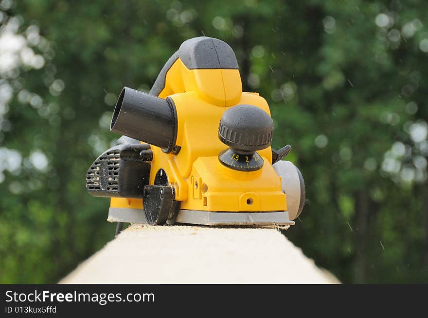 The modern yellow electric planer. The modern yellow electric planer