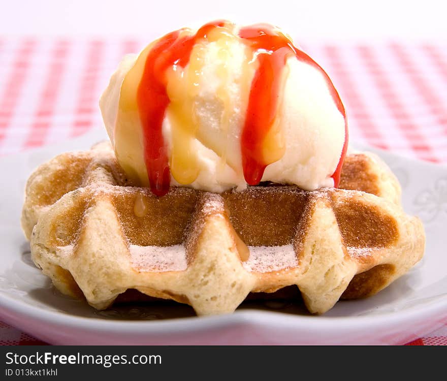 Waffle with vanilla ice cream and strawbarry coating