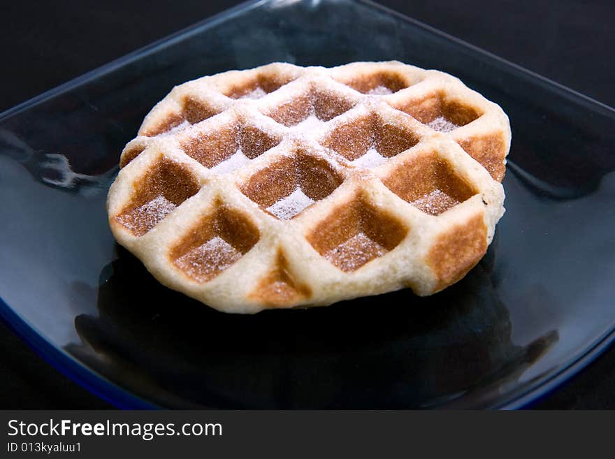 Happy Waffle on plate isolated on black background