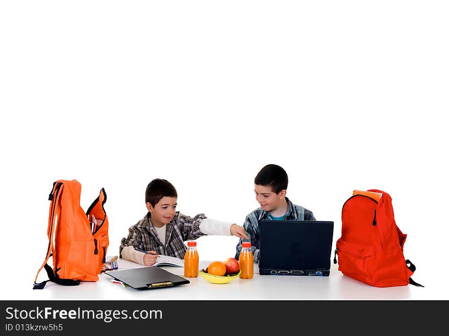 Two young boys doing together studying and homework. Two young boys doing together studying and homework