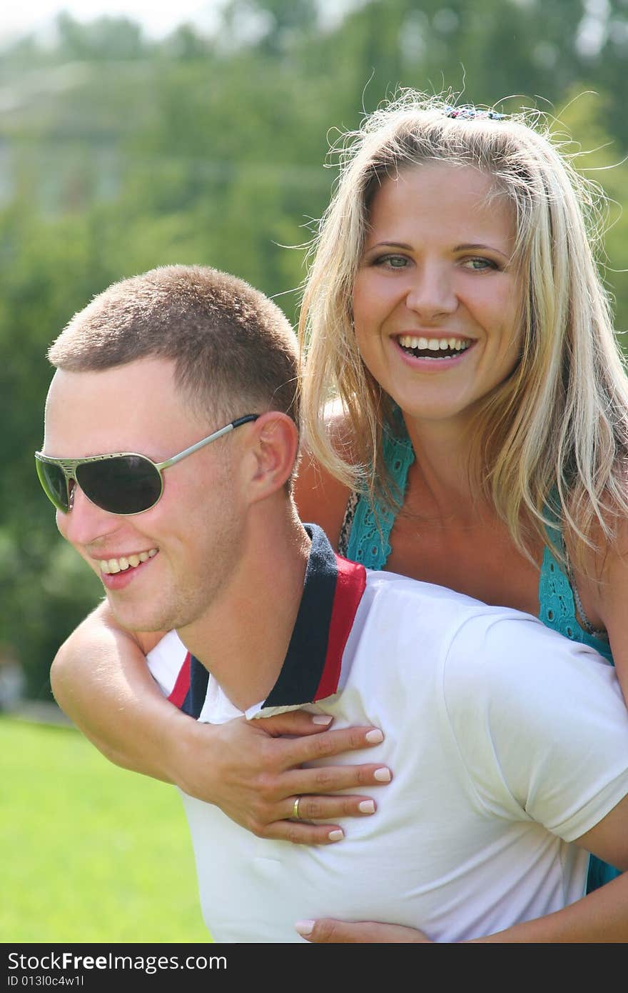 Hatty young couple relaxing in park. Hatty young couple relaxing in park