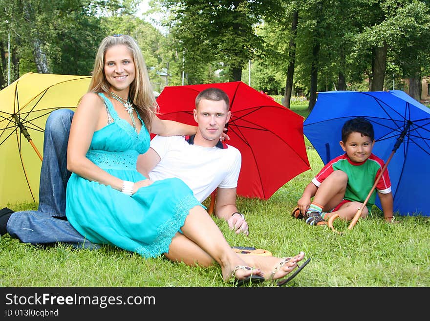 Happy family walking in park. Happy family walking in park