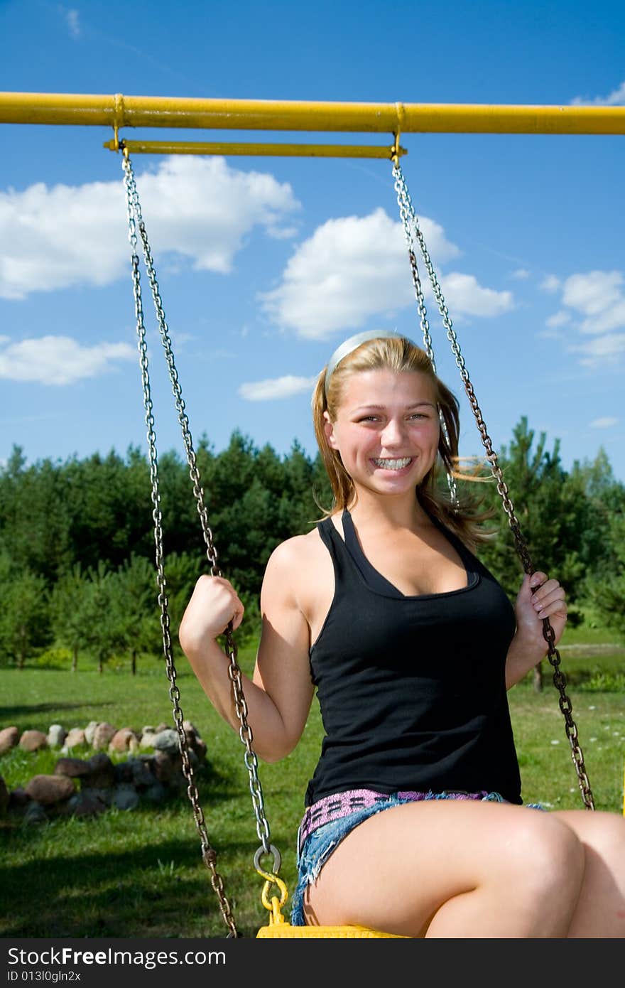 The girl on a yellow seesaw. The girl on a yellow seesaw