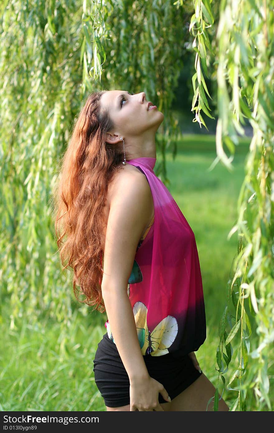 Sexy long-haired girl in park