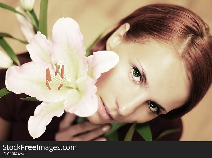 Beautiful young girl with lilly