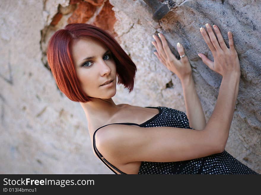 young girl near old wall. young girl near old wall