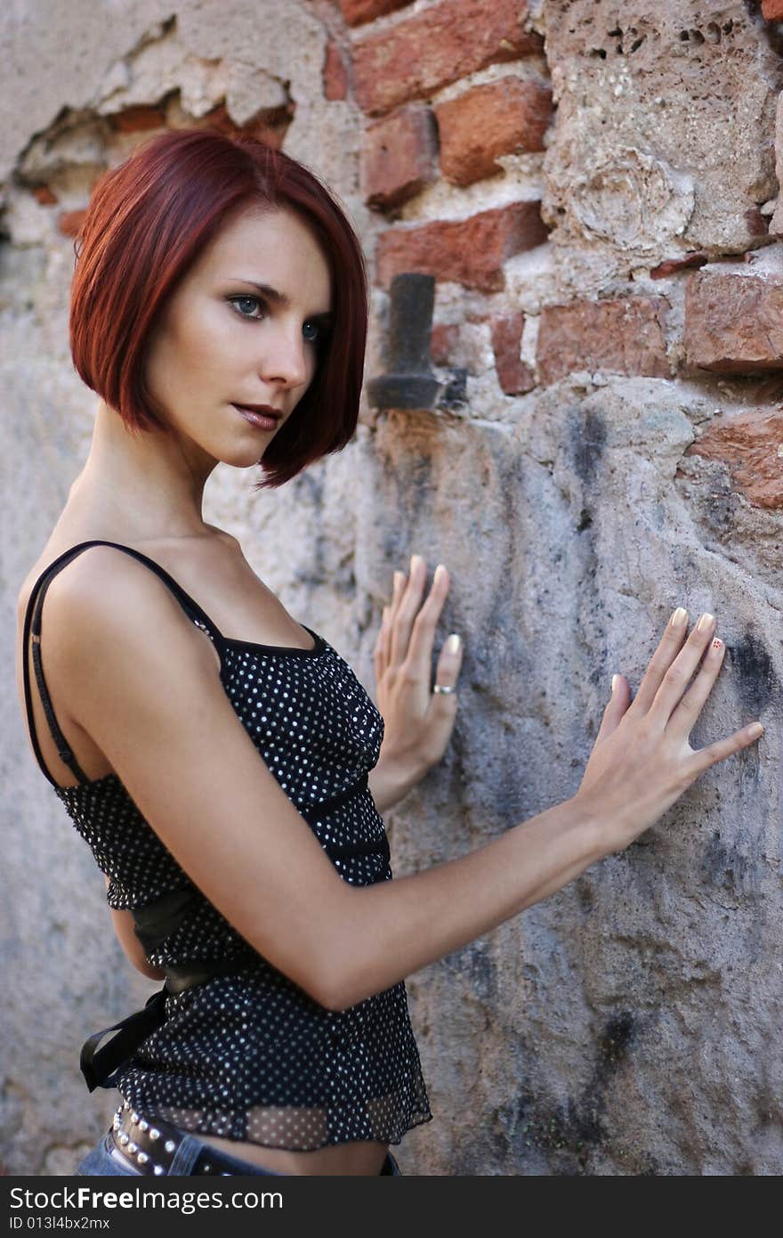 young girl near old wall. young girl near old wall