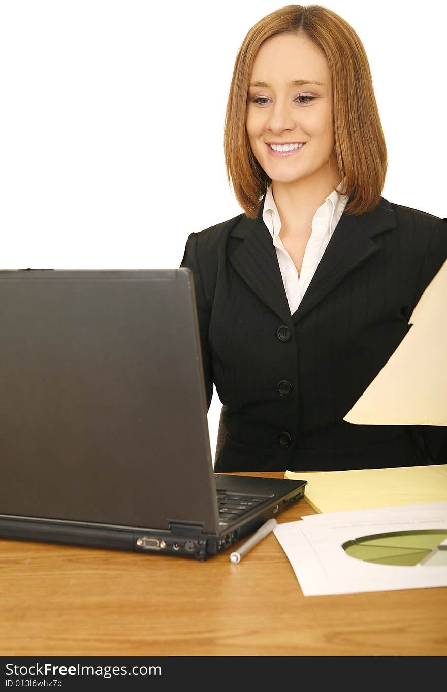 Shot of young business woman looking at her laptop and smile. concept for business and work related. Shot of young business woman looking at her laptop and smile. concept for business and work related