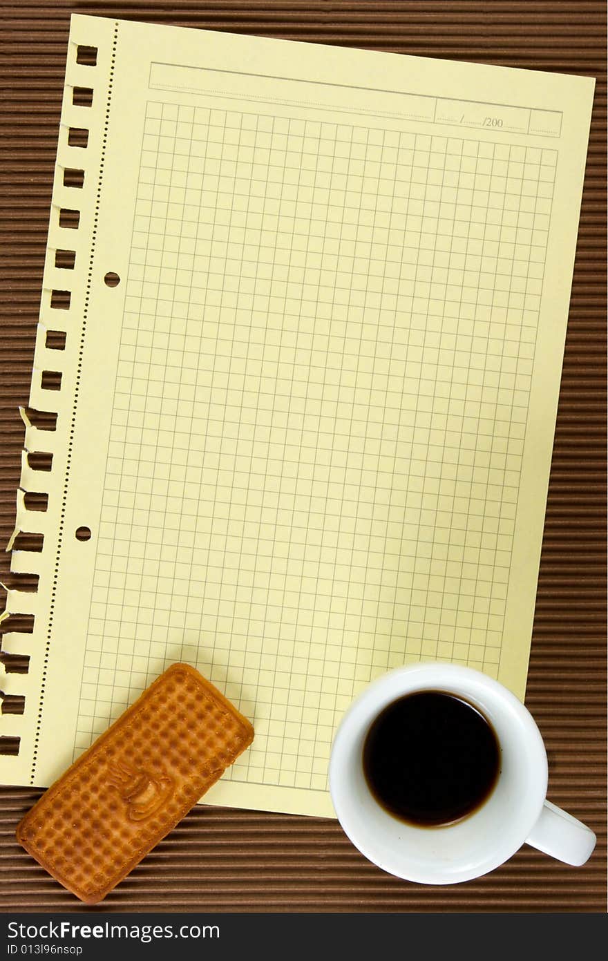 Paper,coffee, biscuits. At brown background. The model for posting your pictures or inscriptions.