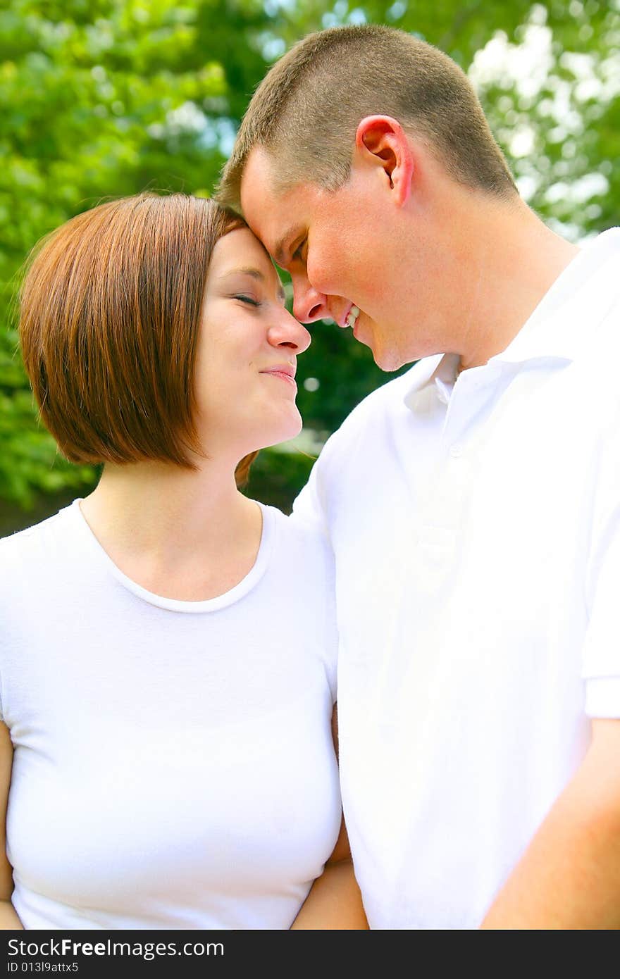 Caucasian Couple Touching Forehead