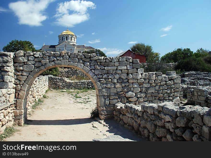 Ruins of ancient building and modern monastyr