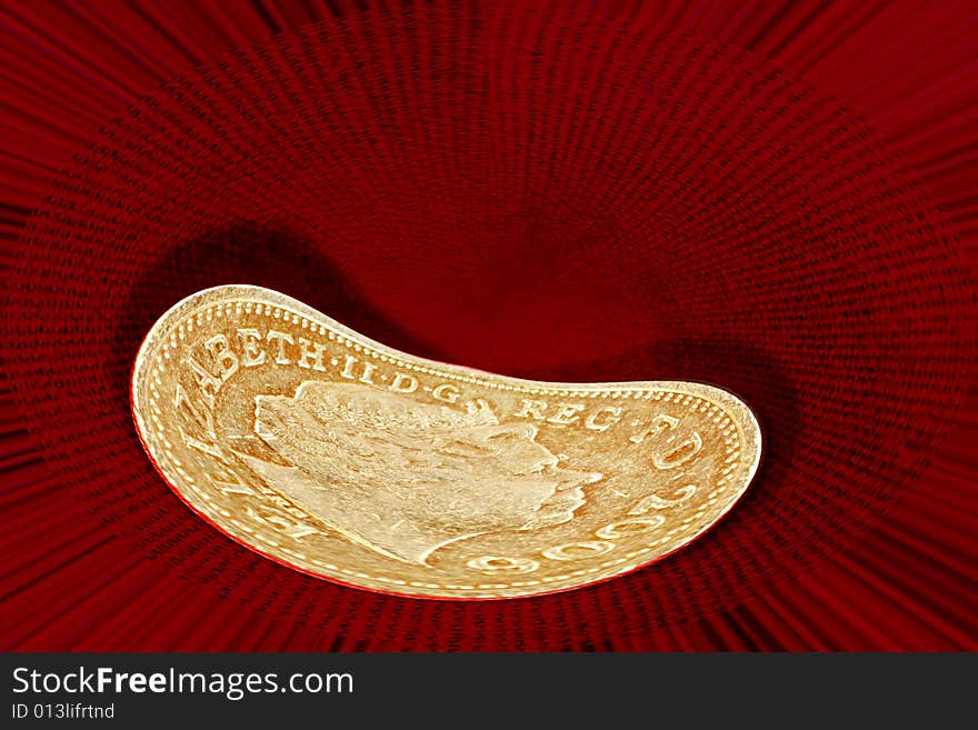 Distorted english pound coin with queen's head