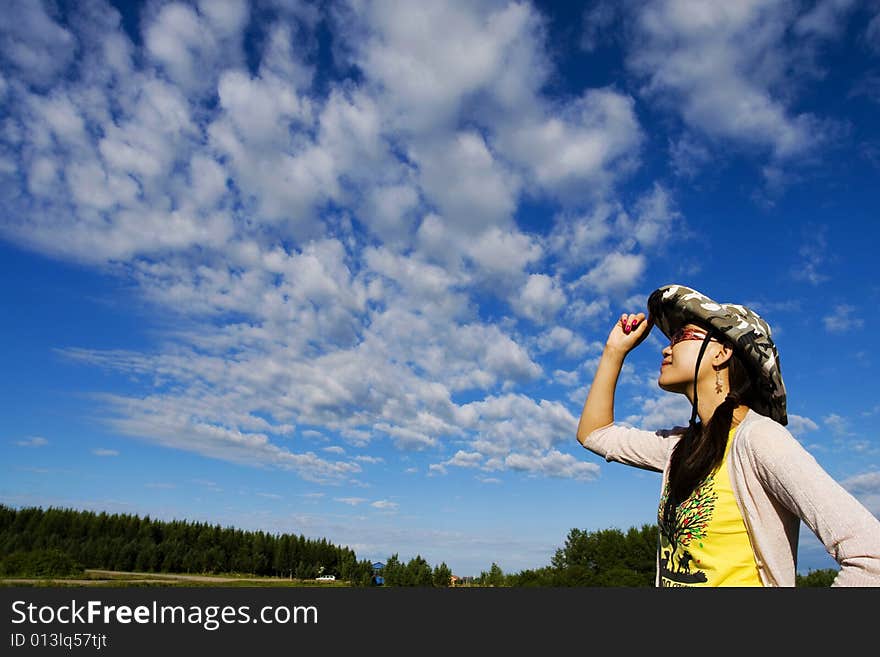 Beautiful girl  in a meadow enjoying the sun. Beautiful girl  in a meadow enjoying the sun