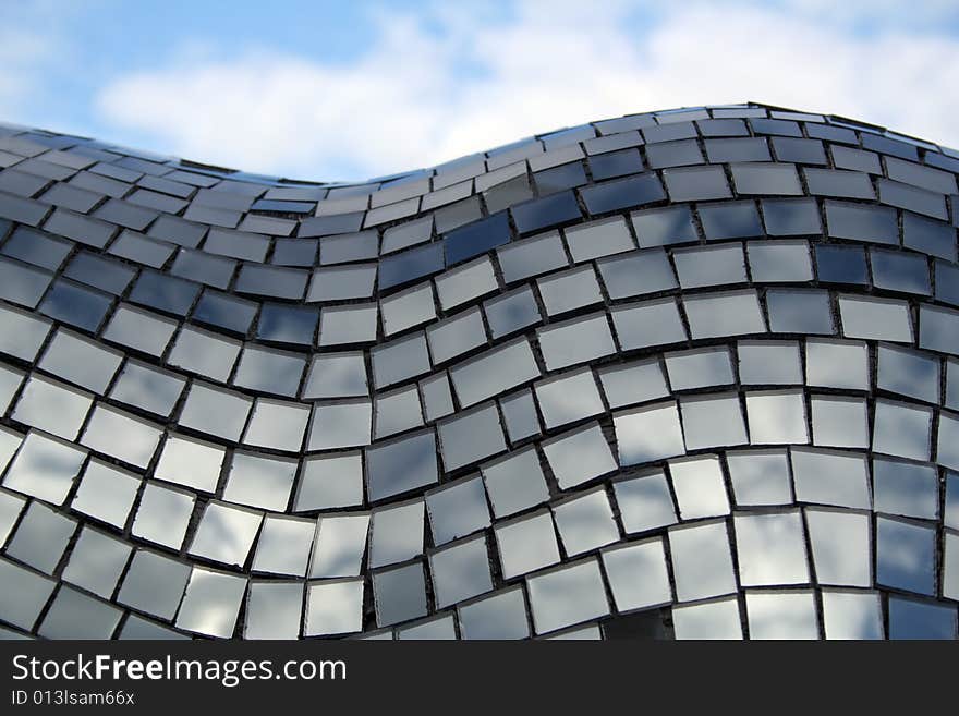 Mosaïc made of little squares of mirrors reflecting the sky. Mosaïc made of little squares of mirrors reflecting the sky.