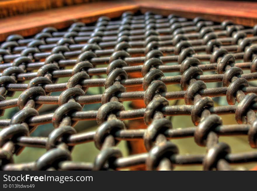 An hdr shot of an old indian styled table with chains covering it. An hdr shot of an old indian styled table with chains covering it