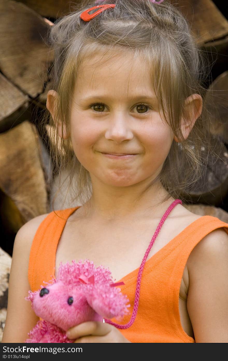 Little girl with red toy