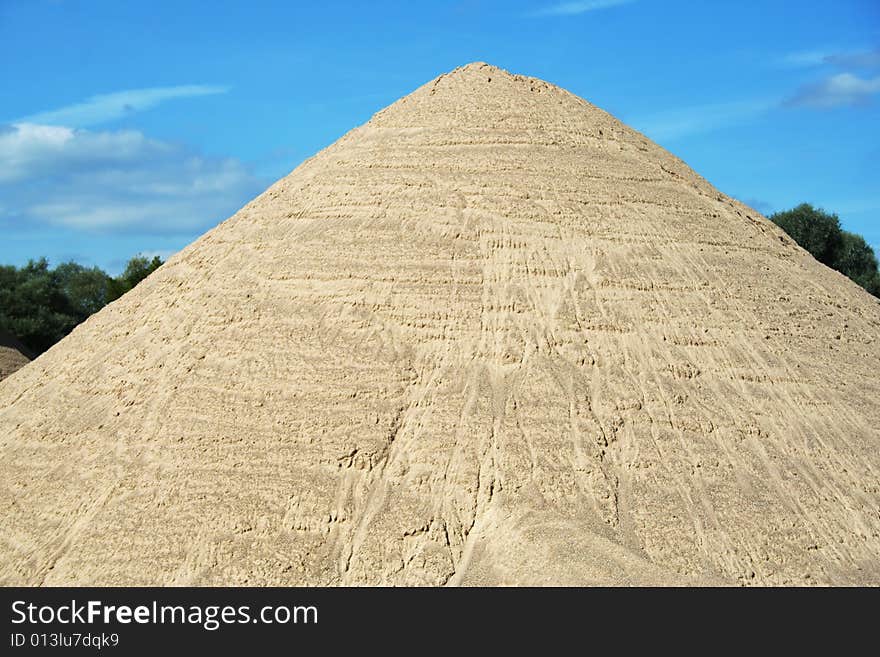 Huge mound of sand in a sand quarry.