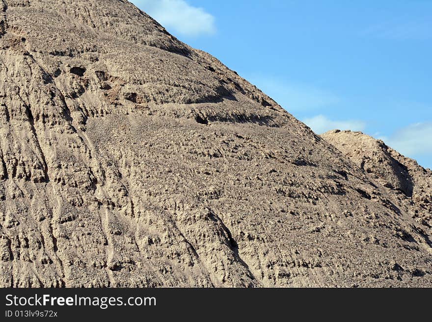 Huge mounds of sand in a sand quarry.