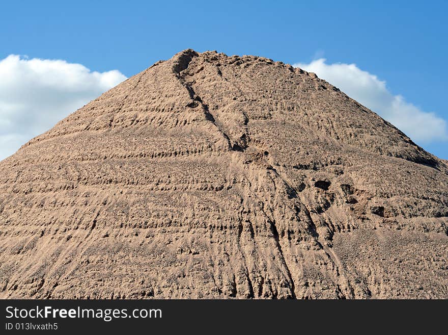 Huge mound of sand in a sand quarry.