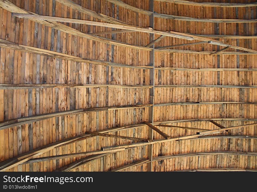 A wooden ceiling of an old barn. A wooden ceiling of an old barn.