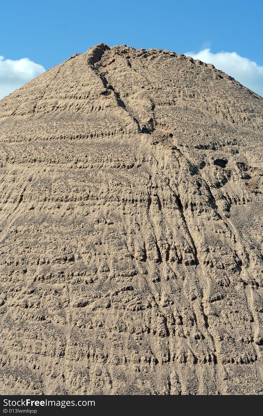 Huge mound of sand in a sand quarry.