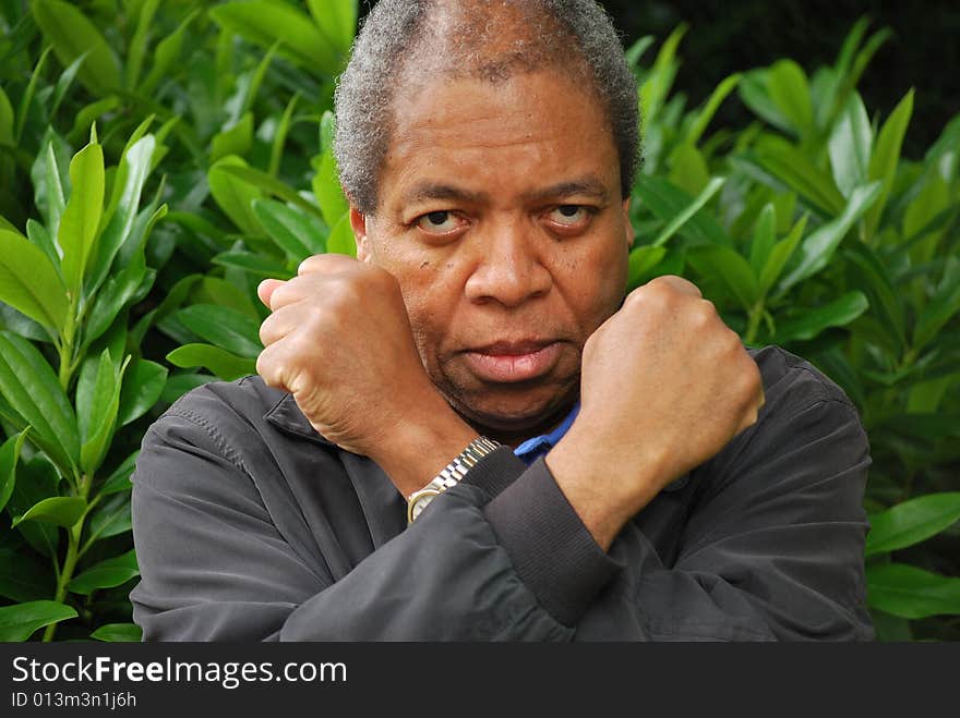 Portrait of an african american man relaxing outdoors. Portrait of an african american man relaxing outdoors.