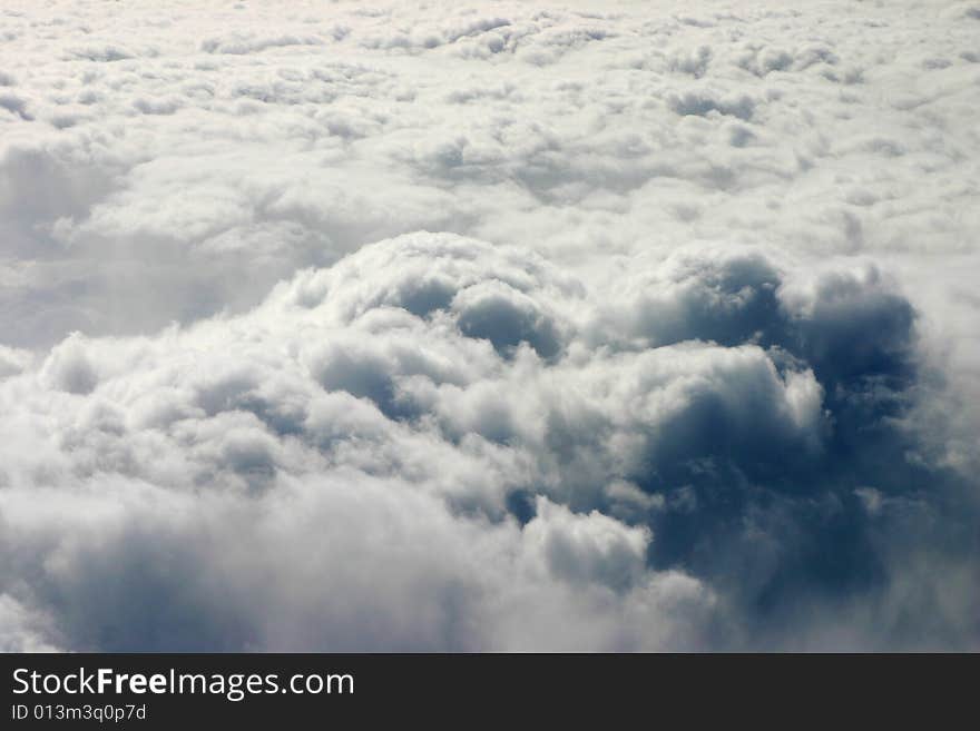 Photograph of clouds taken out of the window of an airplane