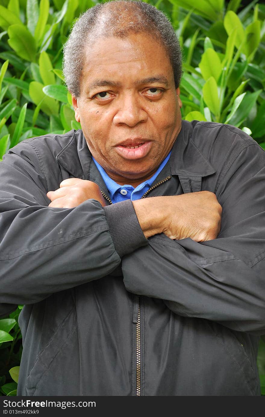 Portrait of an african american man relaxing outdoors. Portrait of an african american man relaxing outdoors.