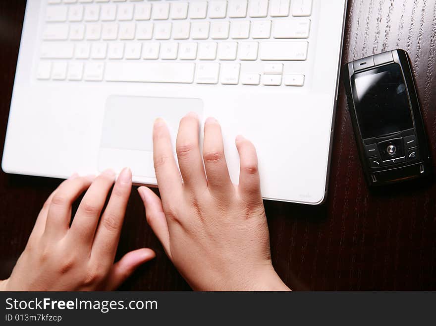 Close-up women's hand on keyboard