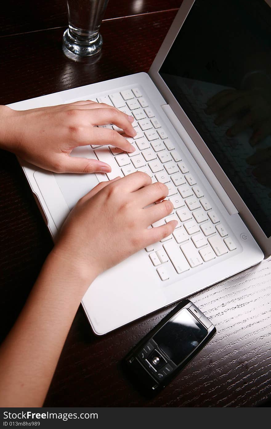 Close-up women's hand on keyboard